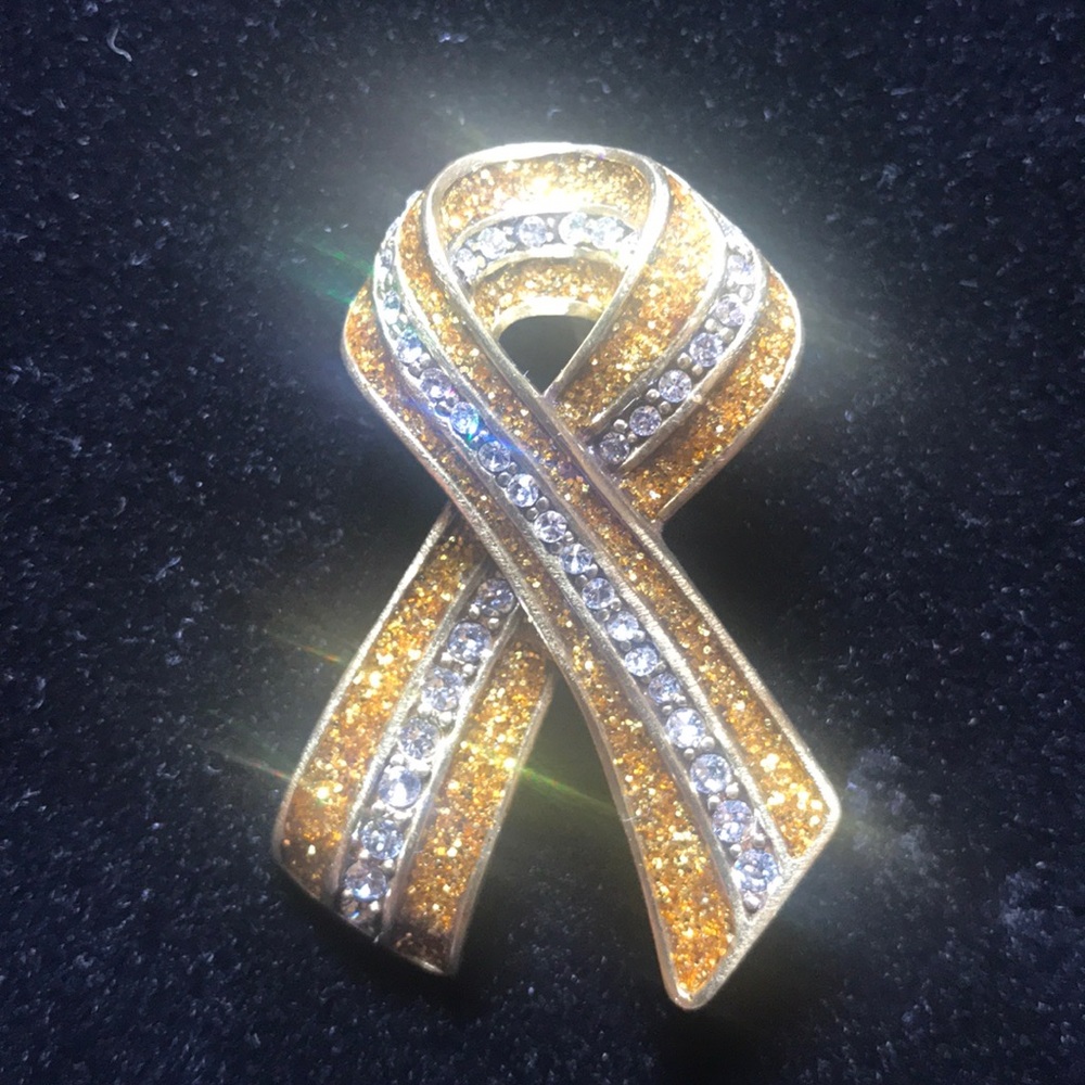 Heidi Daus “sparkle strong” pin